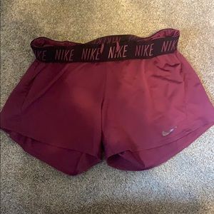 Purple Nike running shorts